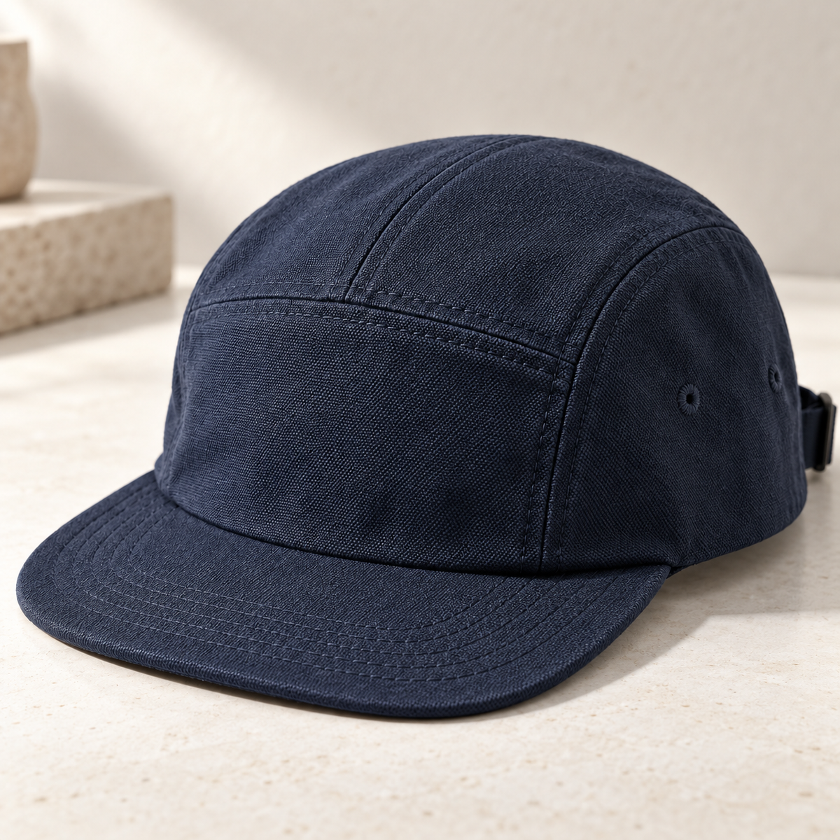 Ink Canvas Cap in navy: surface and stitching detail