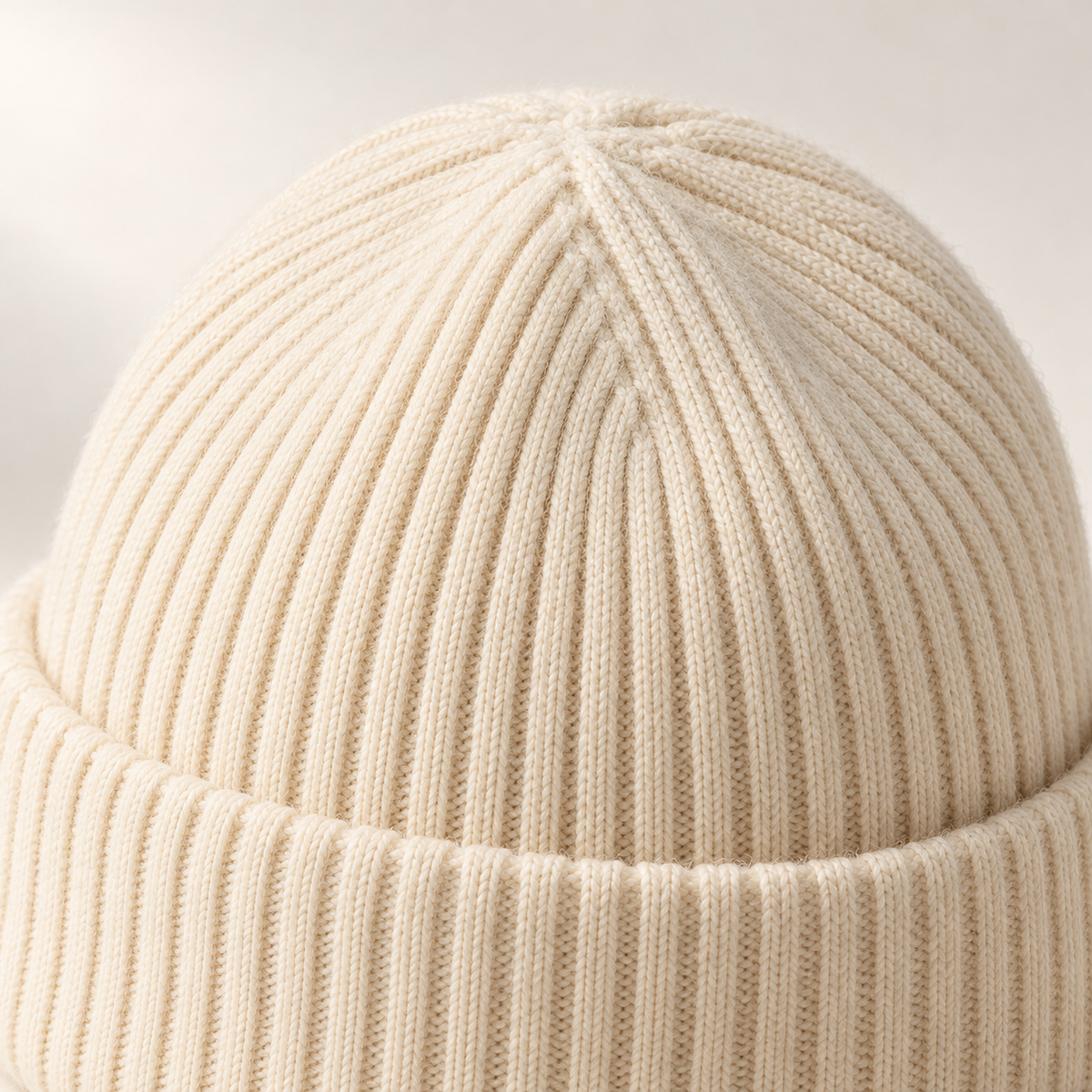 Loft Rib Beanie in ivory: surface and stitching detail