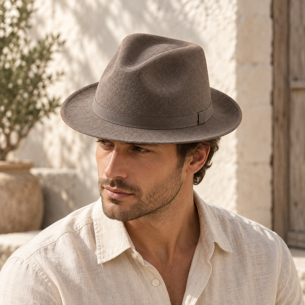 Sierra Felt Fedora in taupe: adult styling view; clothing not included