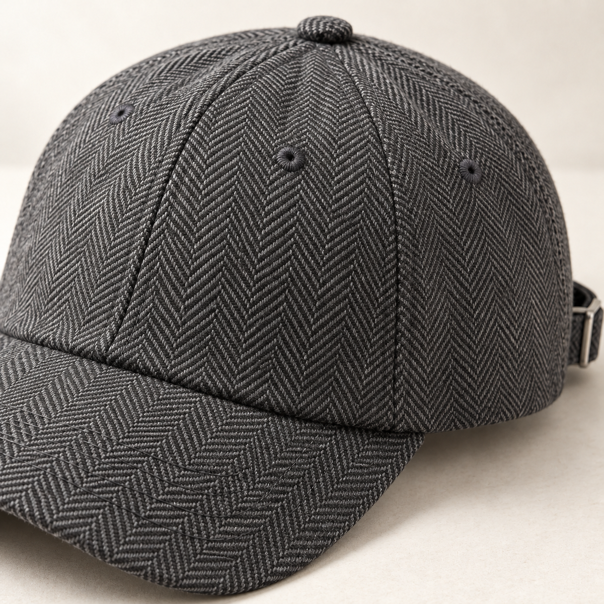 Slate Herringbone Cap in graphite: surface and stitching detail